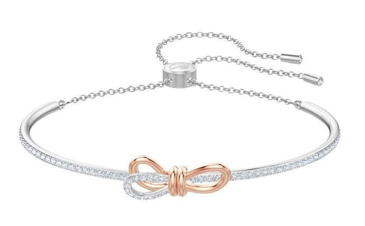 Swarovski Lifelong Bow Rhodium Plated Oval Shaped Bangle With White Crystal 5447079 For Women